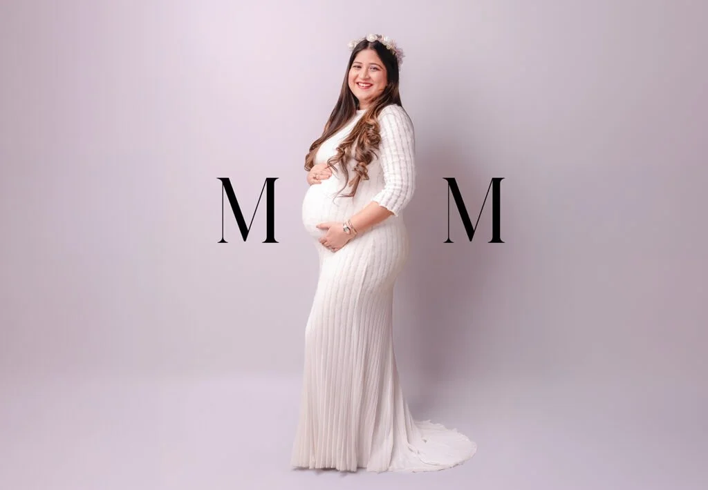 Expecting mother in an elegant maternity photoshoot with soft lighting at Say Cheese studio Ranchi